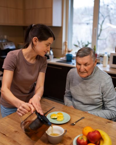 female-caretaker-with-client-home-doing-her-job (2)